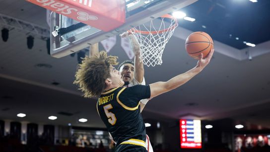 Missouri guard T.O. Barrett (5) attempts a shot over Oklahoma's Brycen Goodine (2) in the first half at Lloyd Noble Center. Missouri guard T.O. Barrett (5) attempts a shot over Oklahoma's Brycen Goodine (2) in the first half at Lloyd Noble Center.